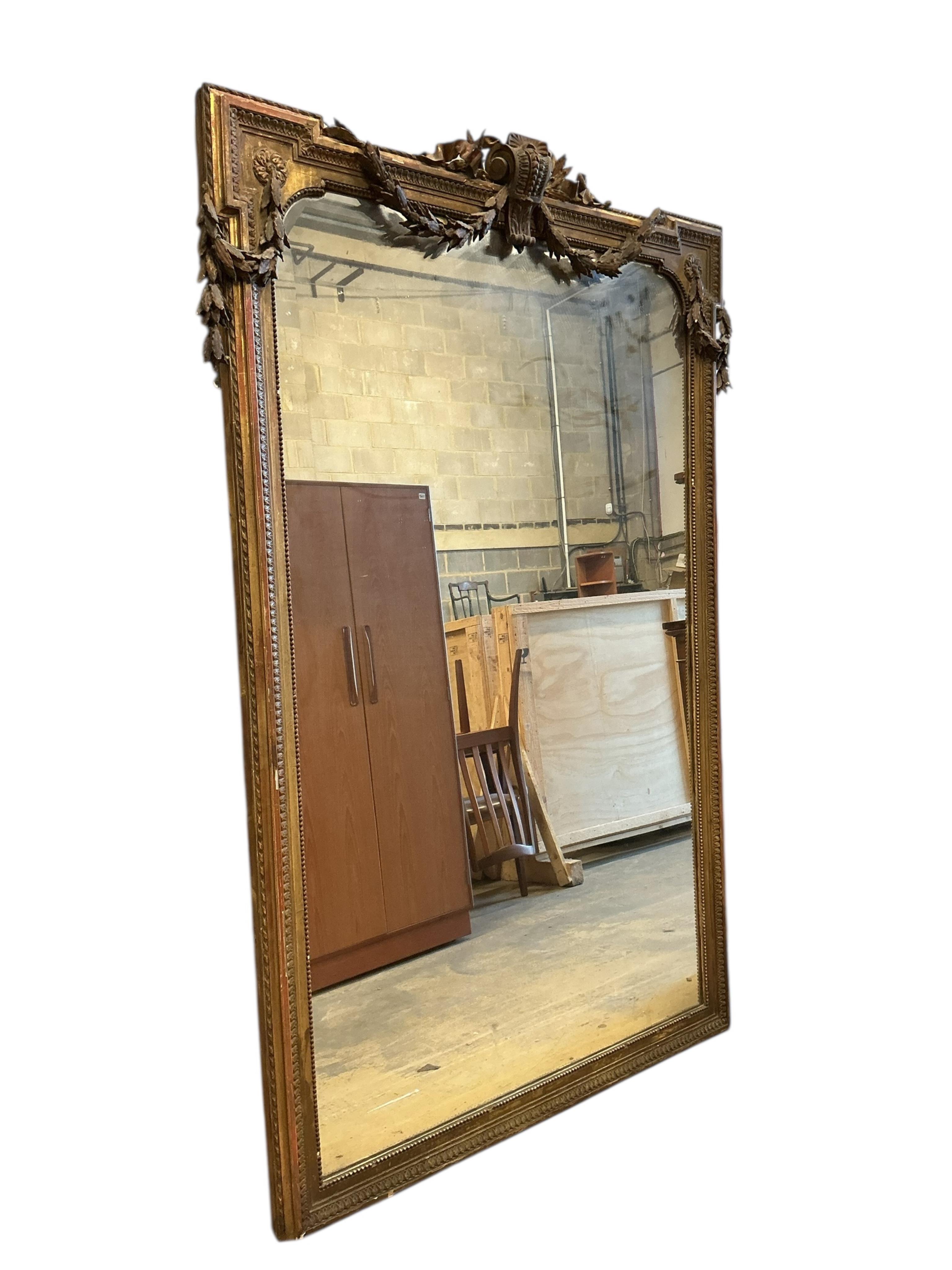 A 19th century carved giltwood and composition overmantel mirror, width 138cm, height 200cm